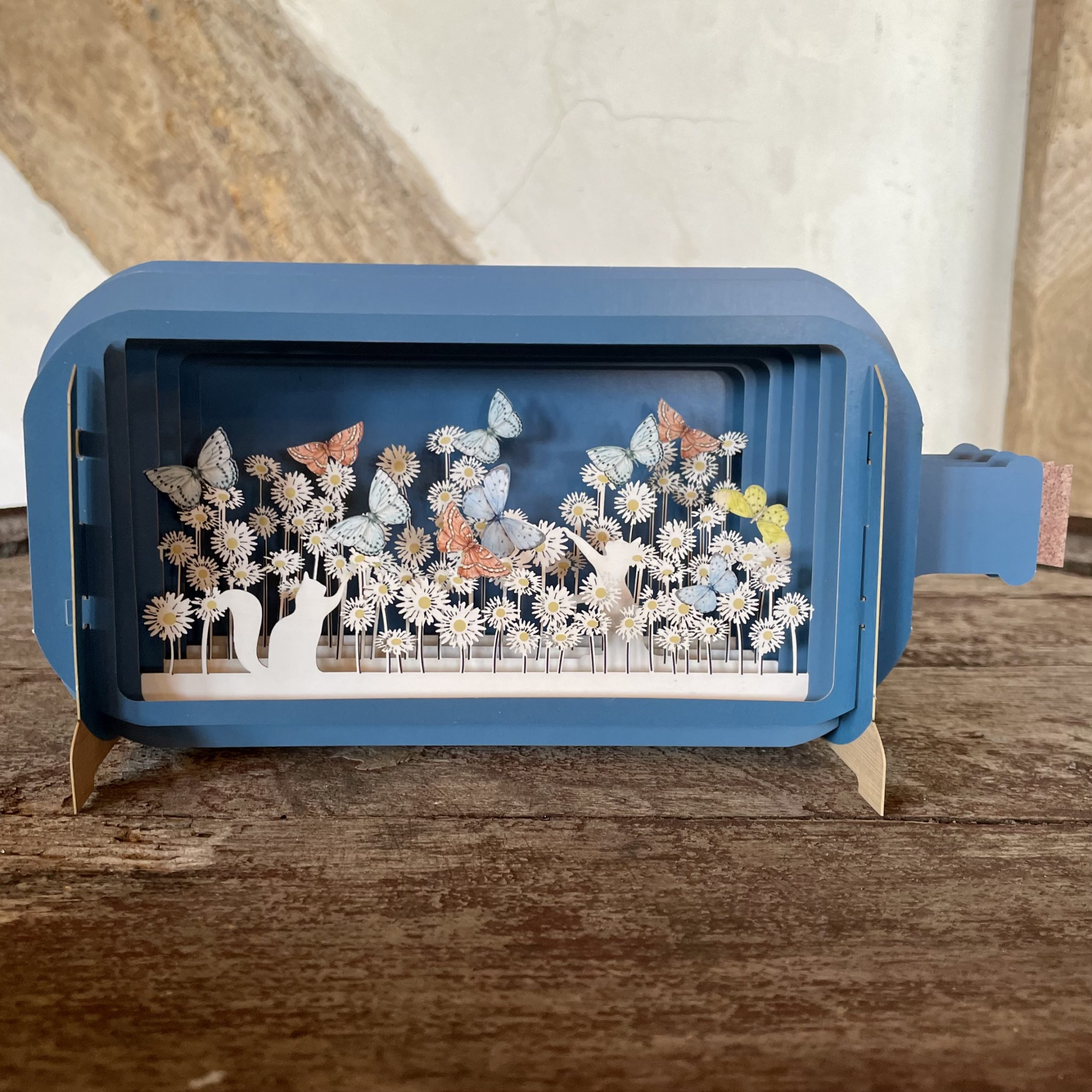 'Cat amongst the flowers' message in a bottle card